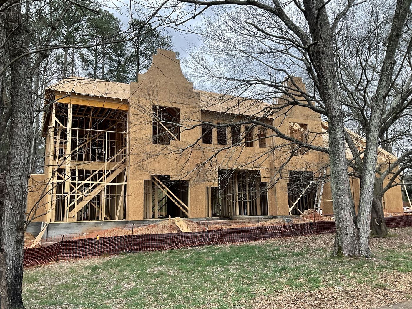 House framing under construction at dusk